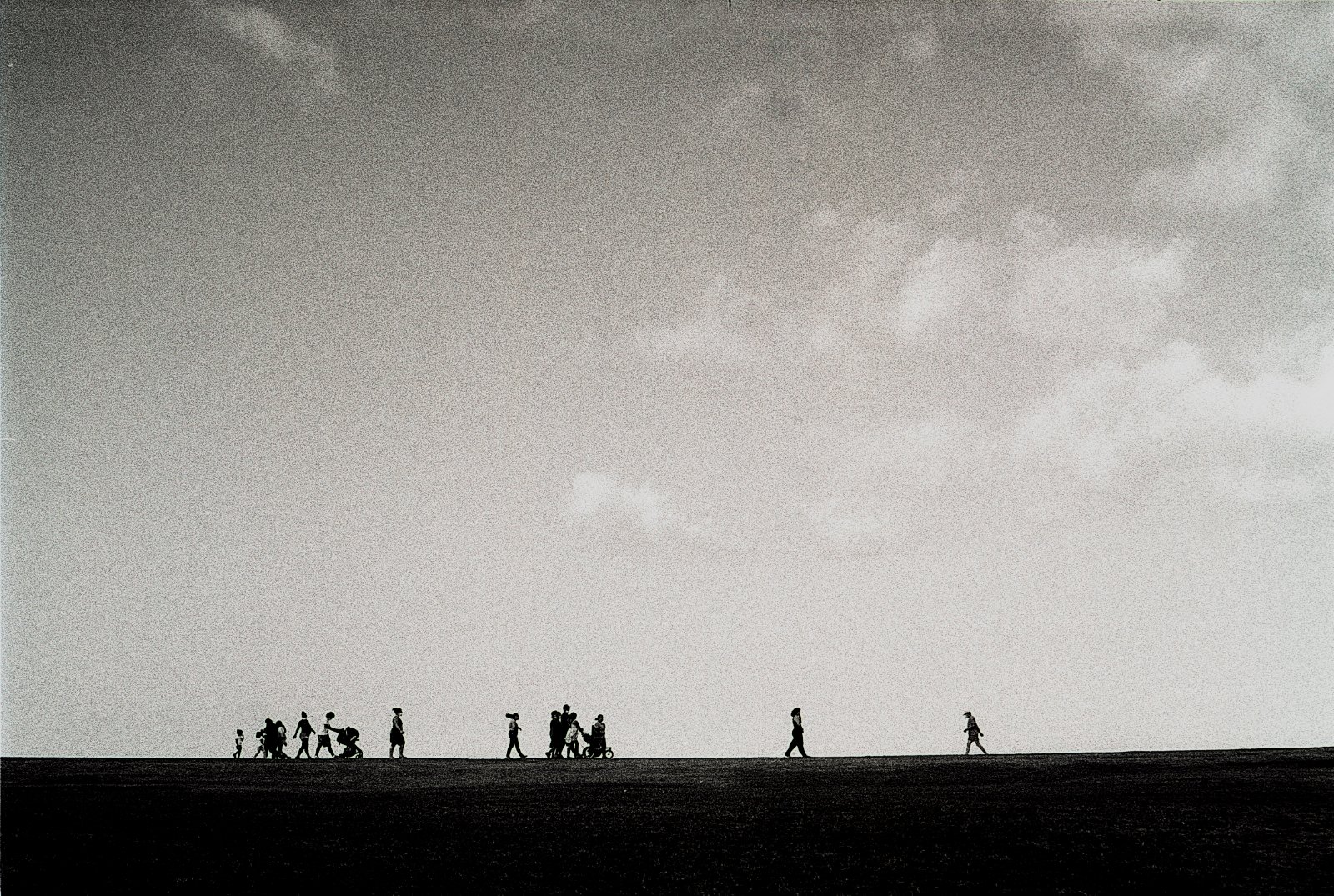 Silohuette of people walking at El Morro